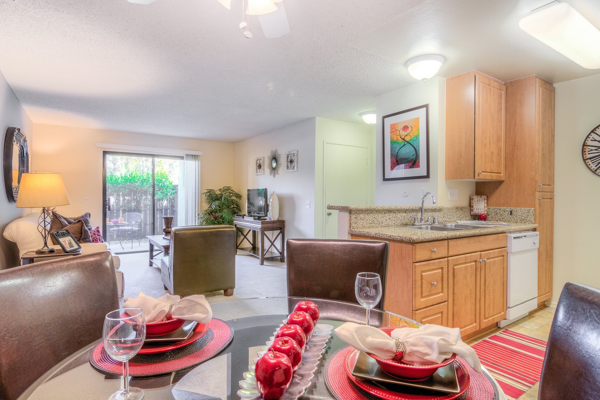 A dining room with a table set for a meal.,A dining room with a table set for a meal.